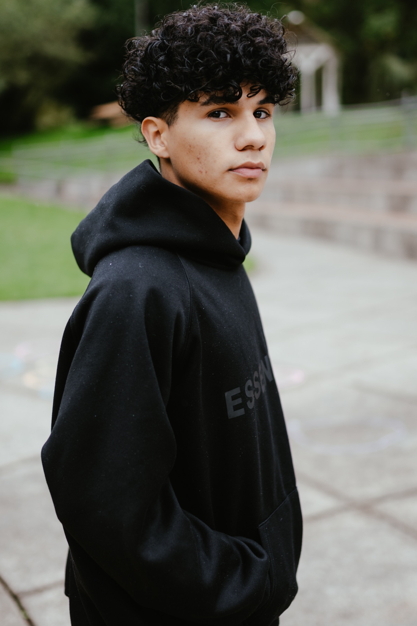 High school graduate in cap and gown at Lake Stevens WA graduation mini session