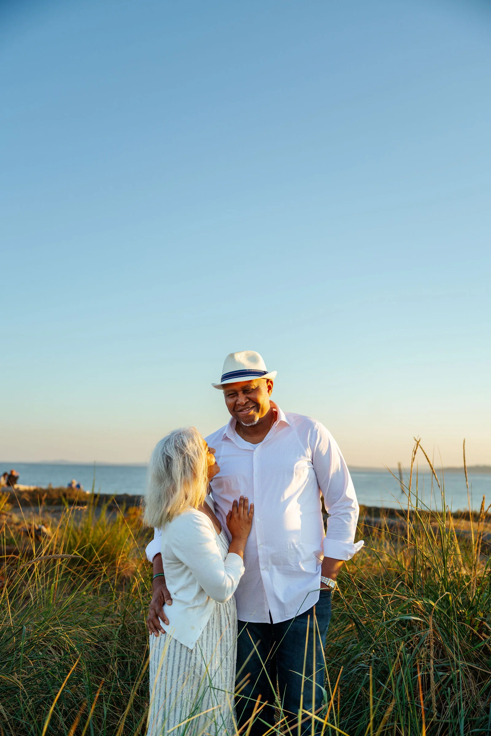 A couple together in the beach dune grass