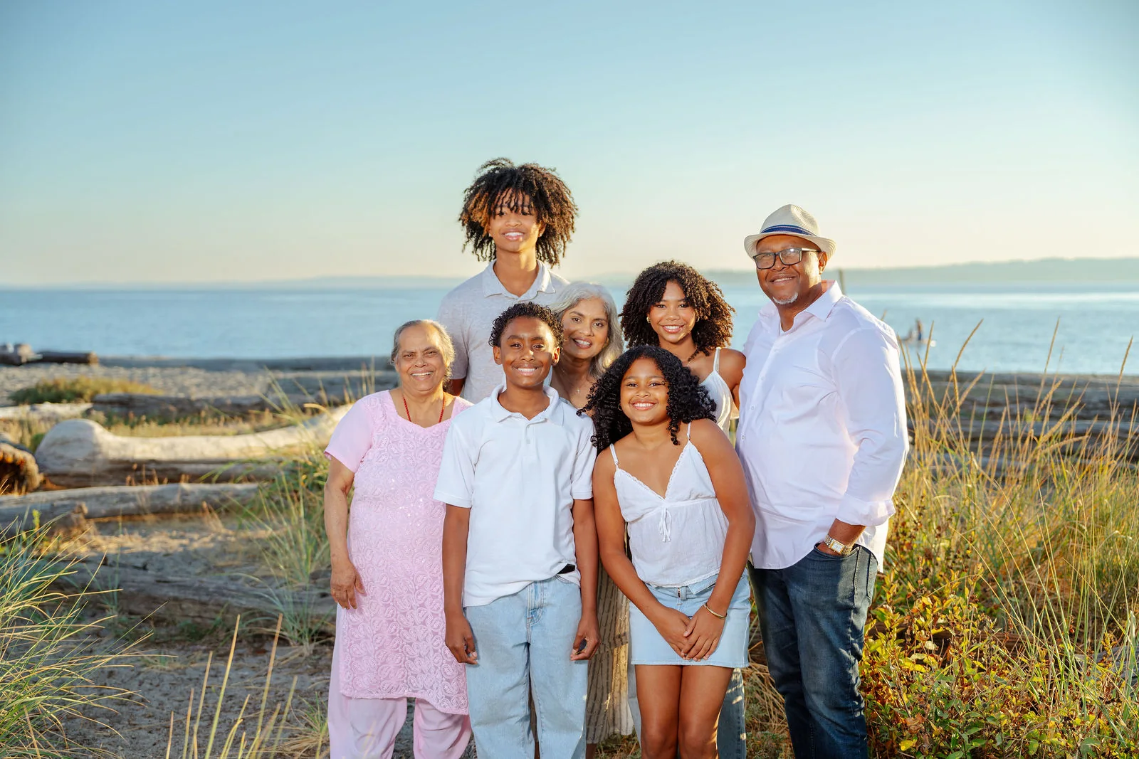 Extended family on the beach as the sun goes down