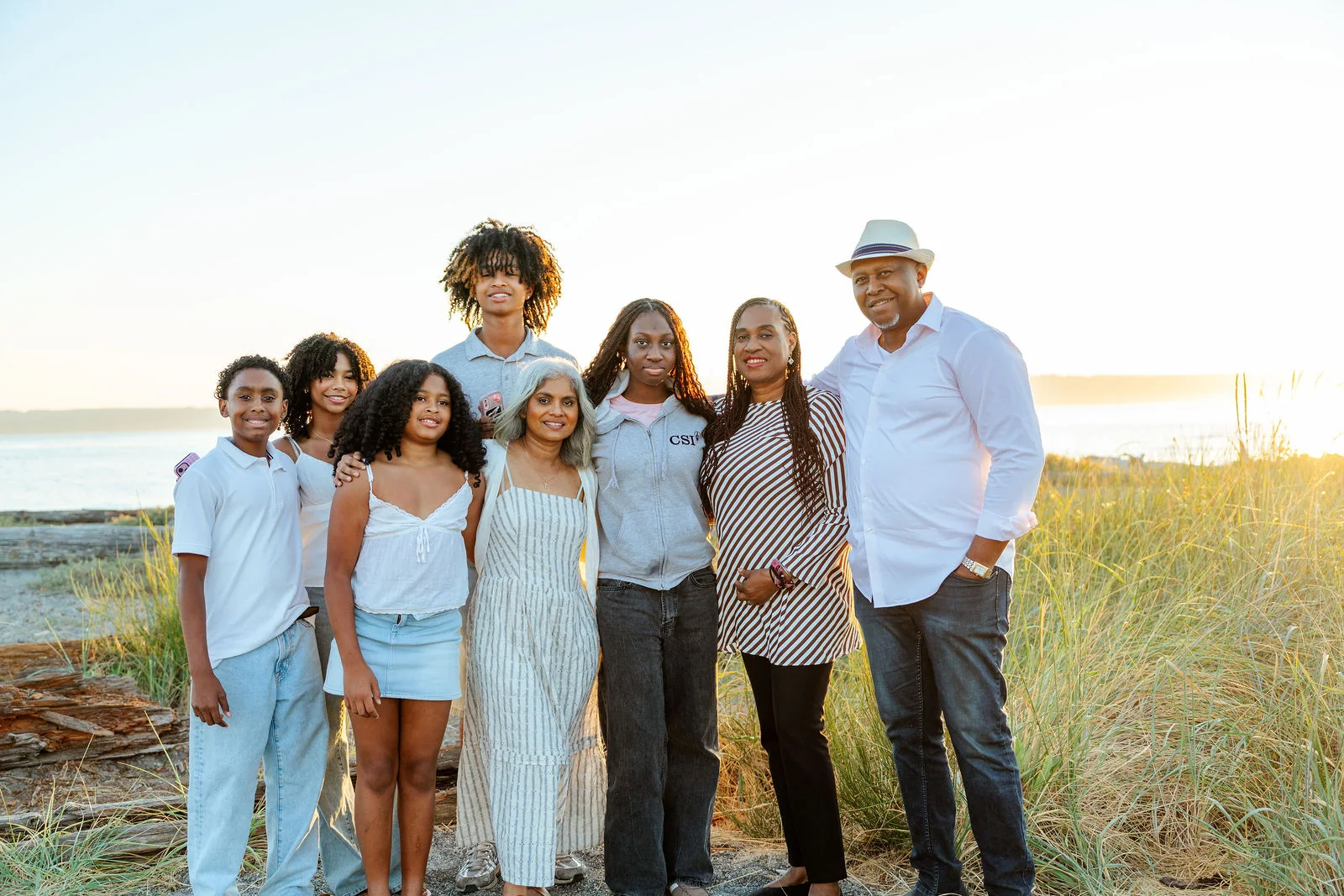 The whole family along the shoreline at golden hour
