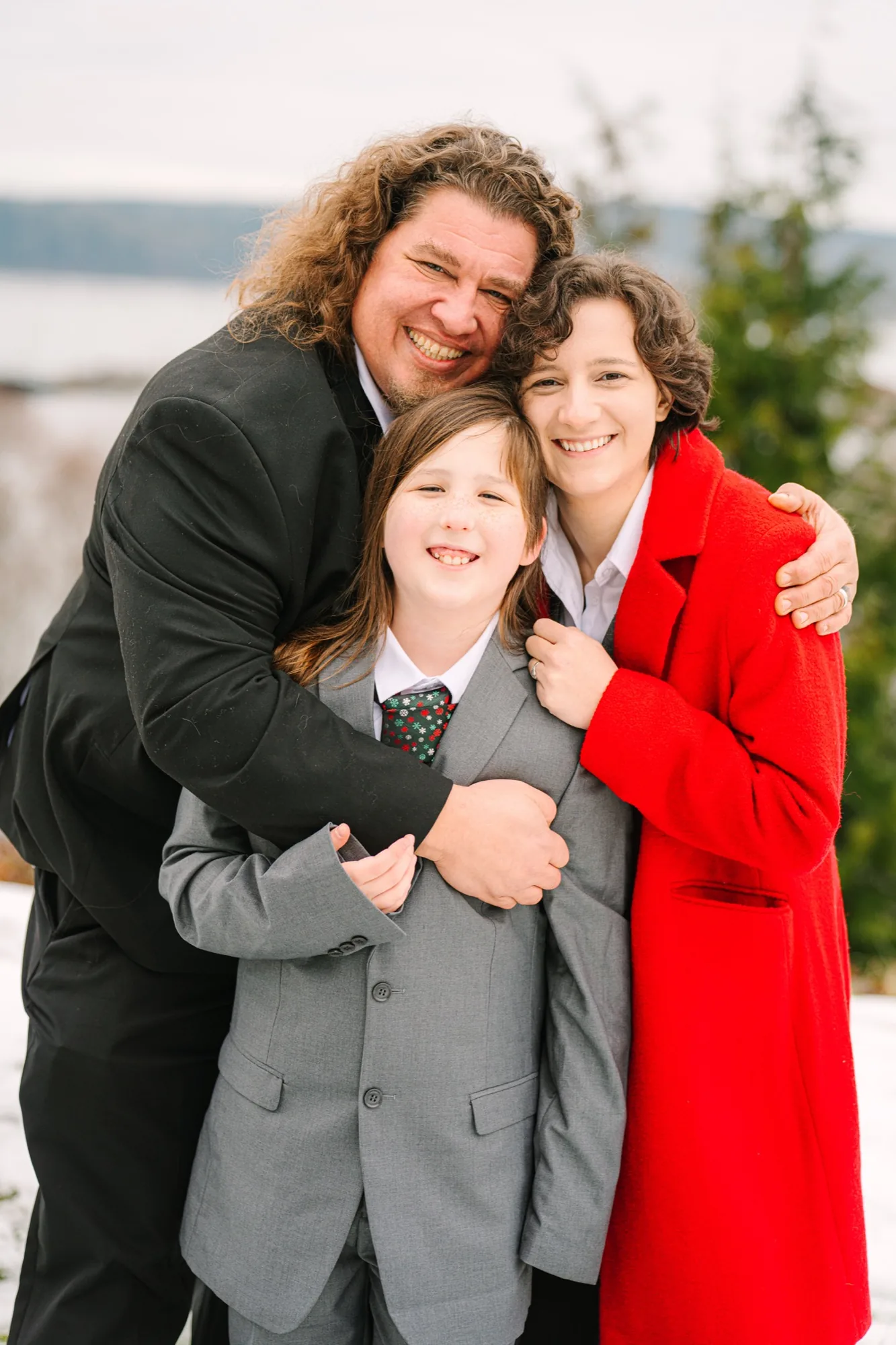 Father hugging his children on a winter afternoon