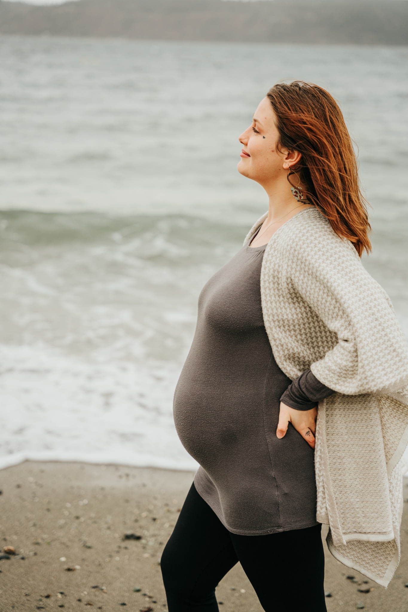 Maternity side profile portrait near the water