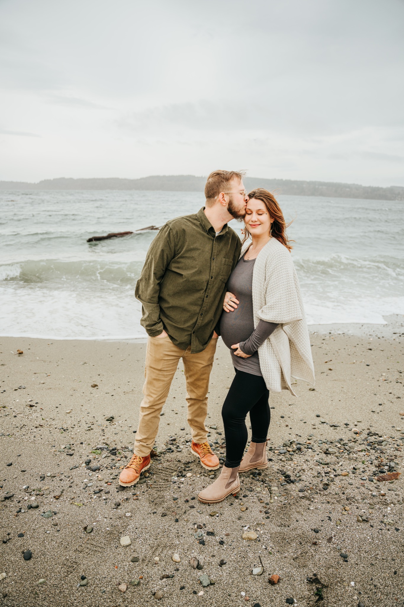 Couple kissing on the beach at sunset near the Edmonds waterfront
