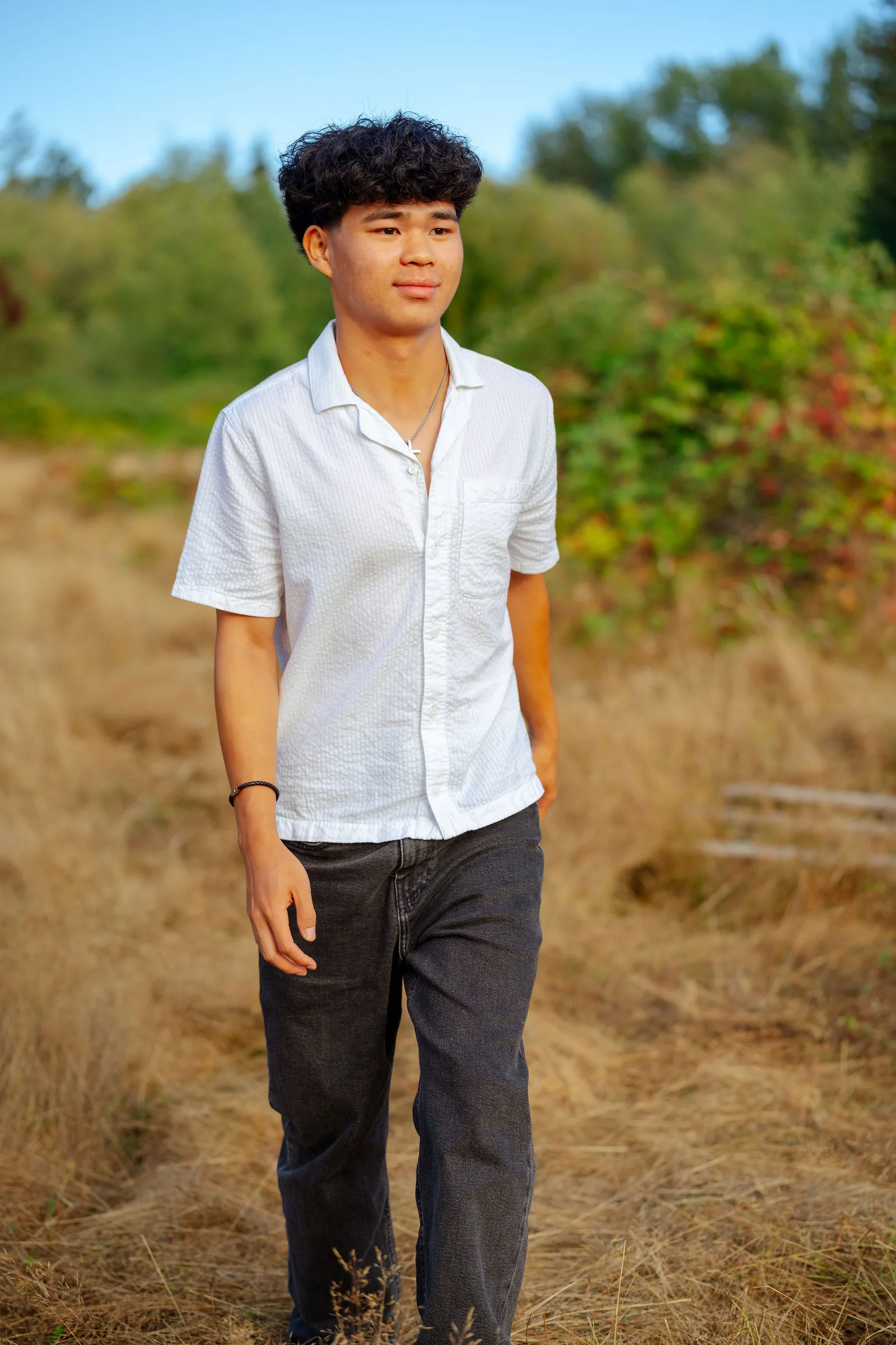 Senior walking through a late-summer field