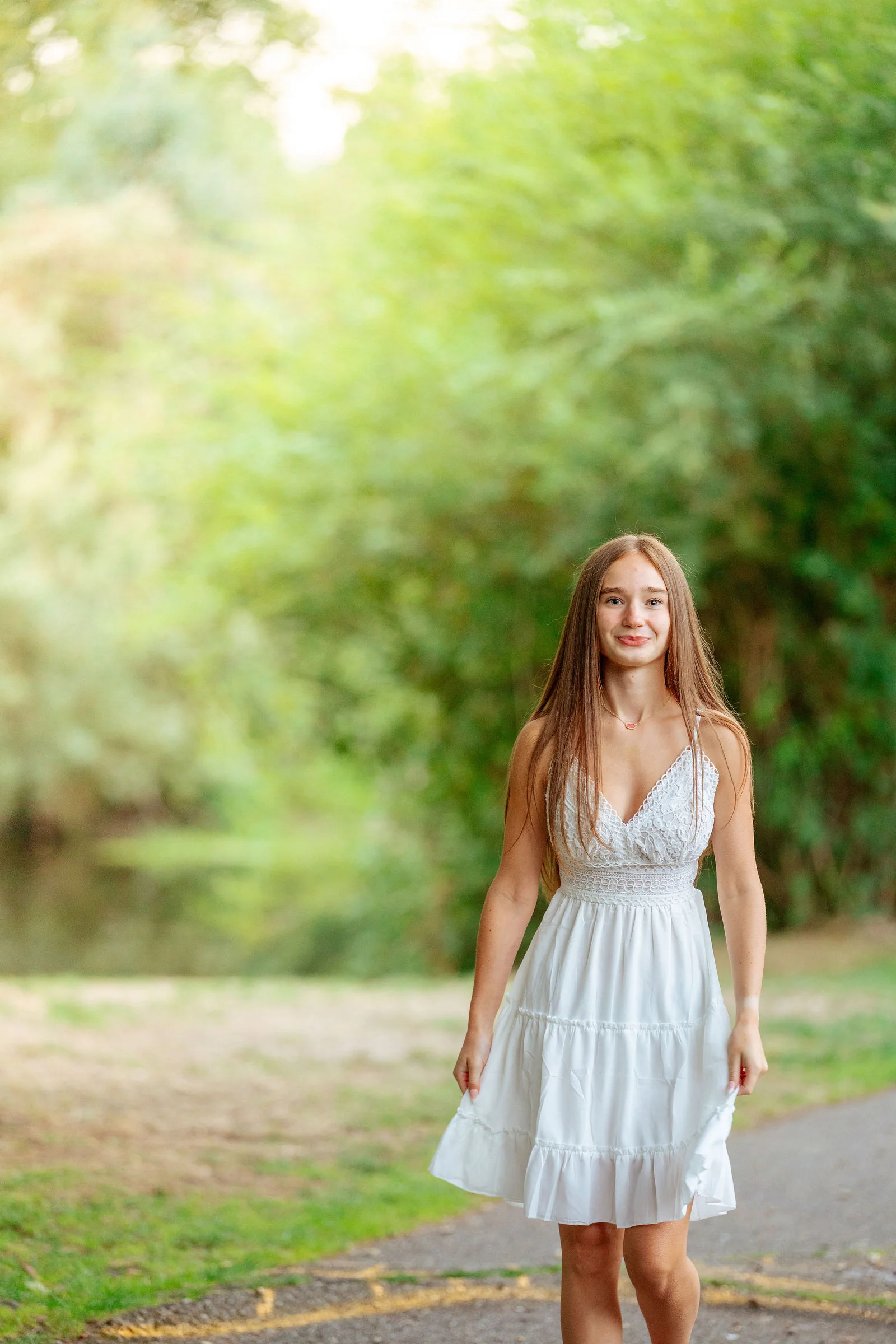 Senior framed by summer greenery
