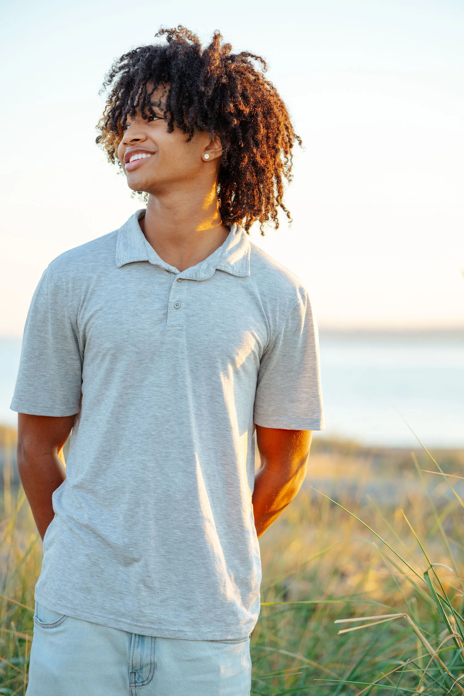 Senior portrait on the shoreline in the last of the light