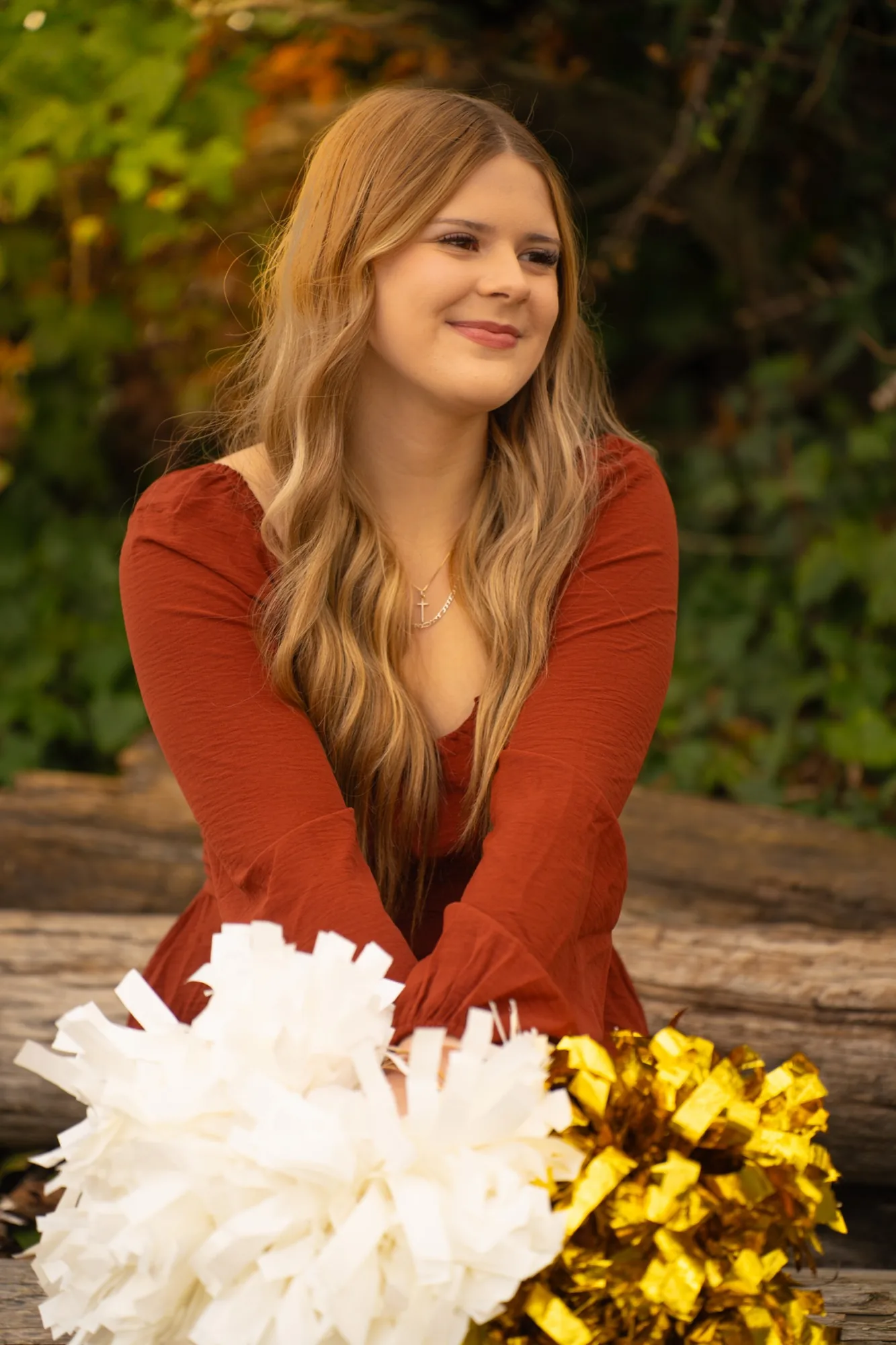 Senior cheerleader in golden autumn light