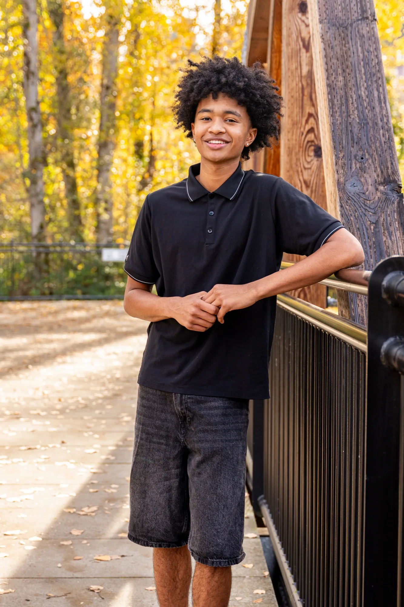 Senior portrait on autumn bridge in Snohomish County