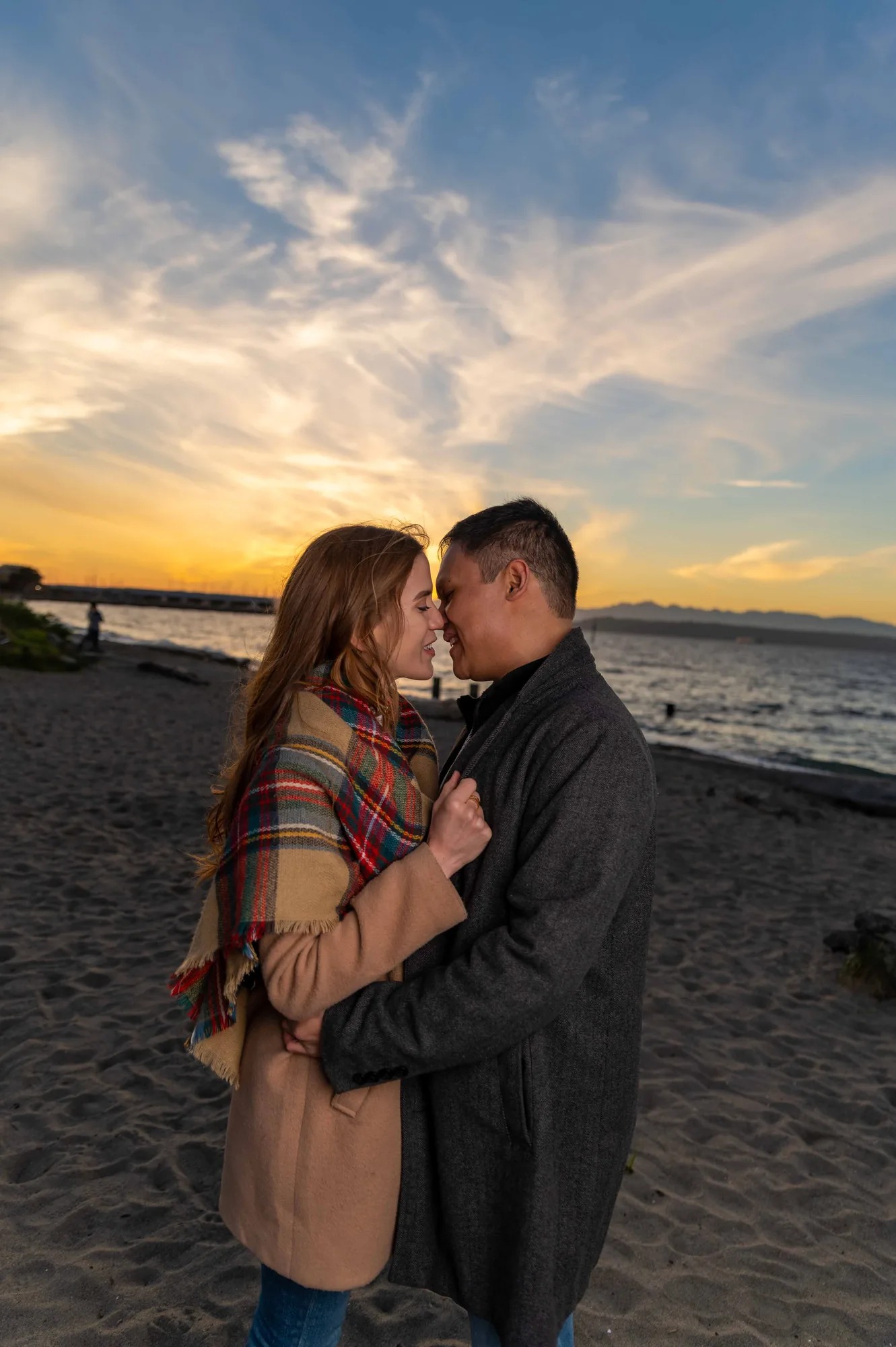 Wedding couple embracing on beach at sunset in Snohomish County