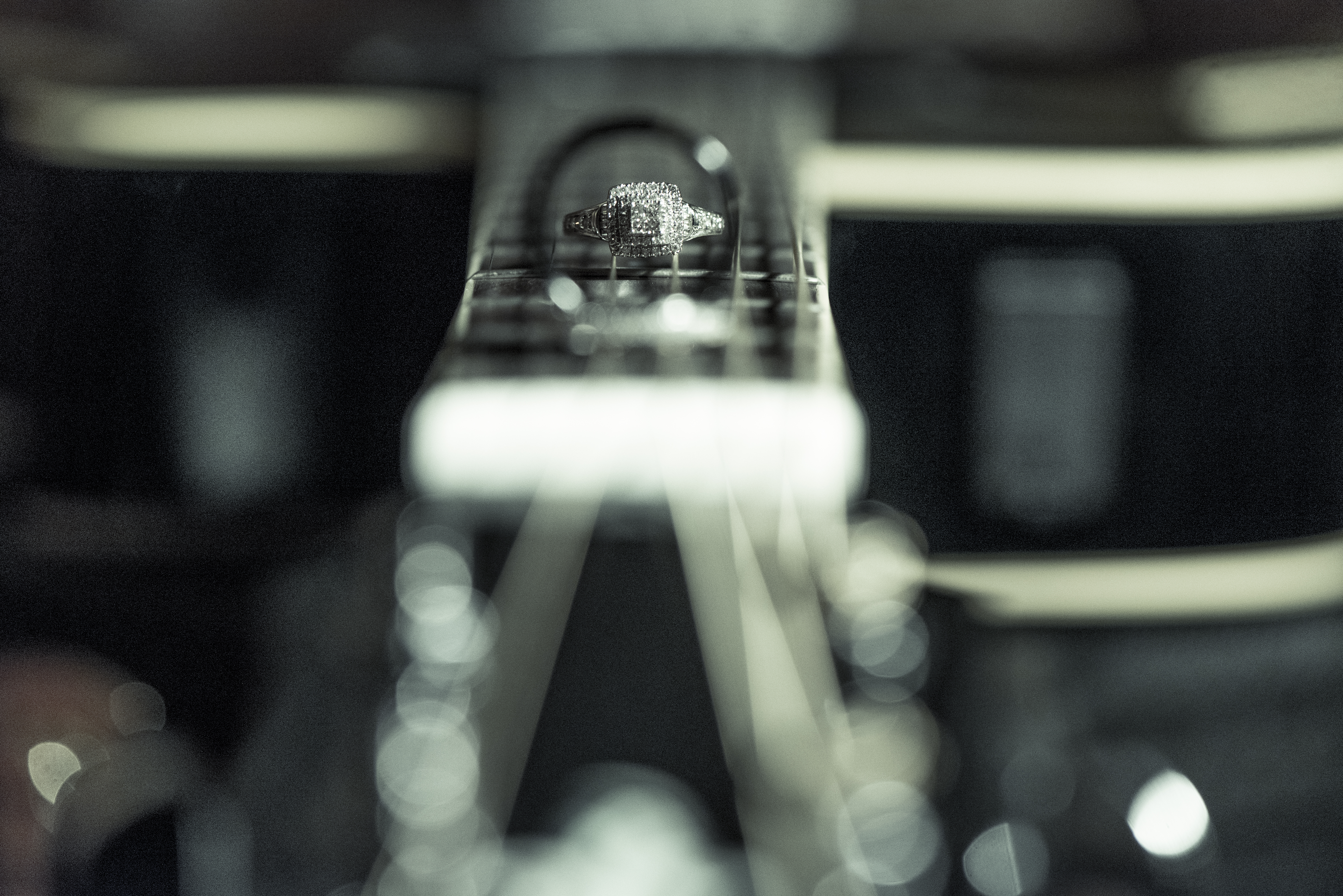 Wedding ring resting on guitar strings at Snohomish County wedding