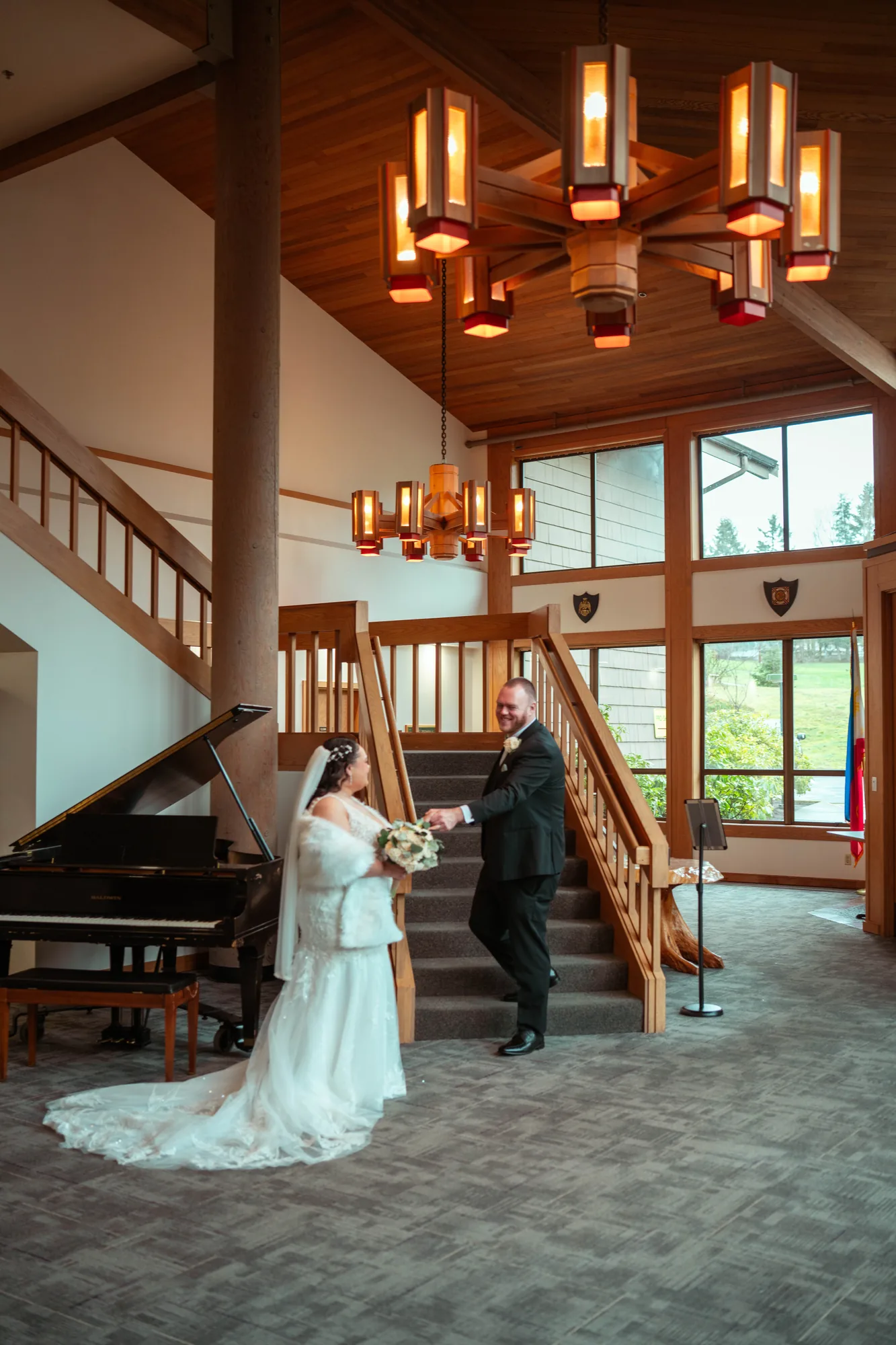 Bride and groom indoor portrait with chandelier at Snohomish County wedding venue