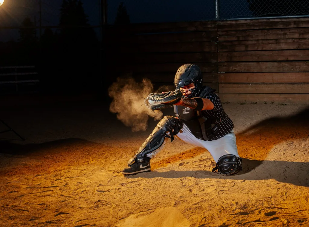 Senior athlete in uniform, dramatic side light — SunnyT Productions