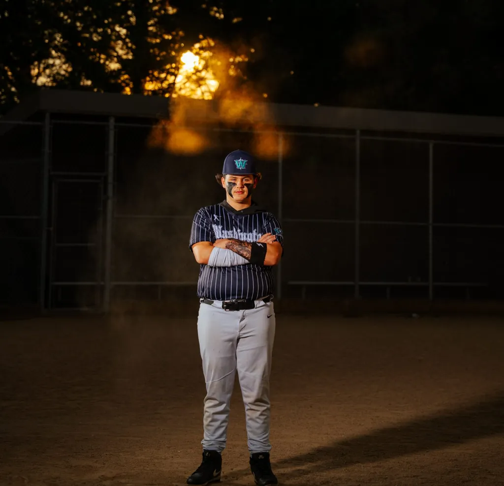 Senior sports portrait on the field — SunnyT Productions